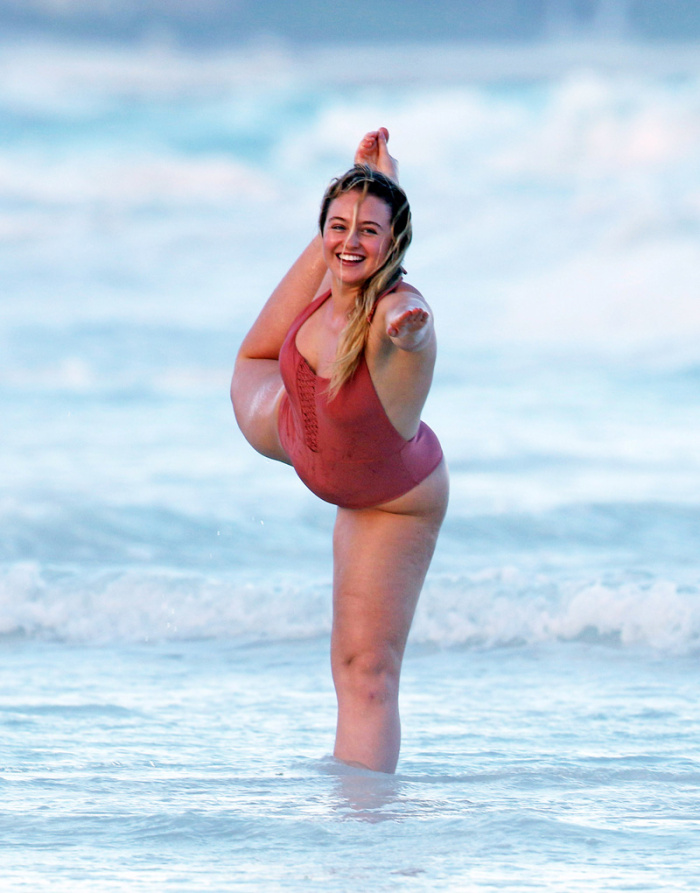 Iskra Lawrence in a one piece bathing suit while the beach in Tulum Mexico.