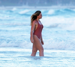 Iskra Lawrence in a one piece bathing suit while the beach in Tulum Mexico.