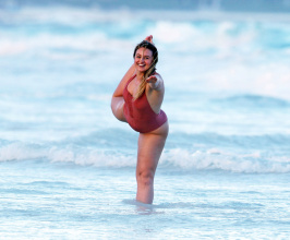 Iskra Lawrence in a one piece bathing suit while the beach in Tulum Mexico.