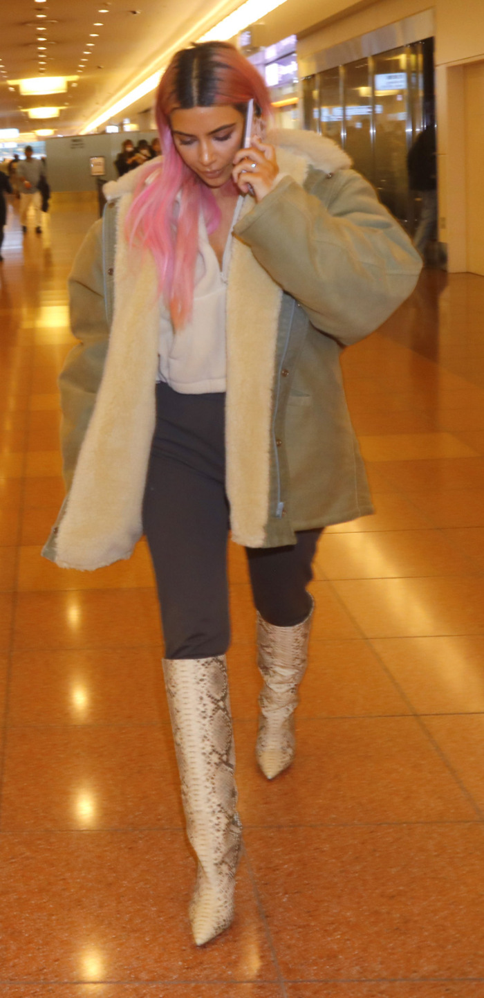 Kim Kardashian is all smiles as she poses with fans upon landing in Tokyo with her sisters for their first family trip overseas together in 2018. Kim was very happy to take some photos with her loyal fans as she flashed a peace sign and was spotted in customs with Kourtney and Khloe as they had their entourage and luggage with them. The girls made their way through the airport as a group and headed out of the airport for their first night in the city.