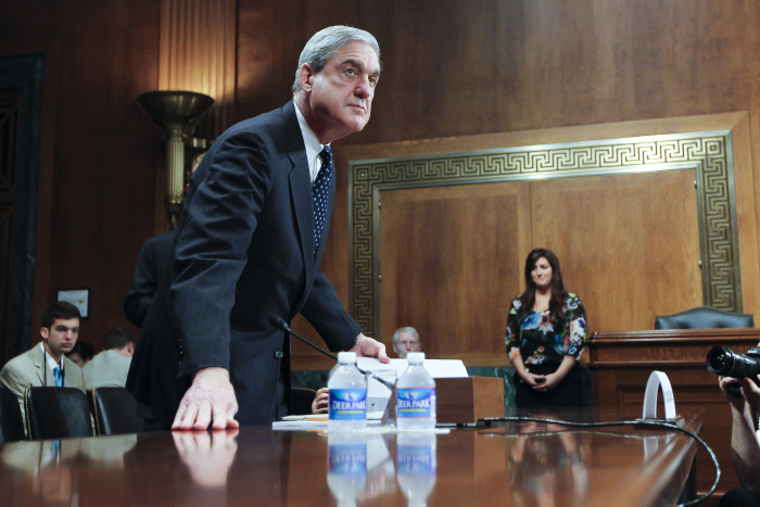 Russia Probe Robert Mueller chats with senators prior to testifying before the Senate Judiciary Committee Hearing on oversight of the Federal Bureau of Investigation.