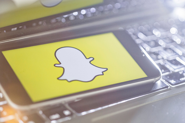 n this photo illustration the logo of Snapchat is displayed on a smartphone on May 04, 2017 in Berlin, Germany.
