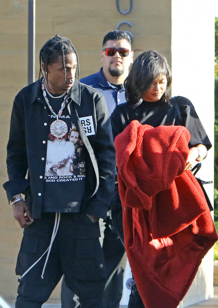 Kylie Jenner and Travis Scott dine with friends at Nobi in Malibu, CA. The new parents left the hotspot with a gang of security in toe as they made their way to their black LaFerrari super car. Recently a LaFerrari was auctioned off for 7.5 million dollars.