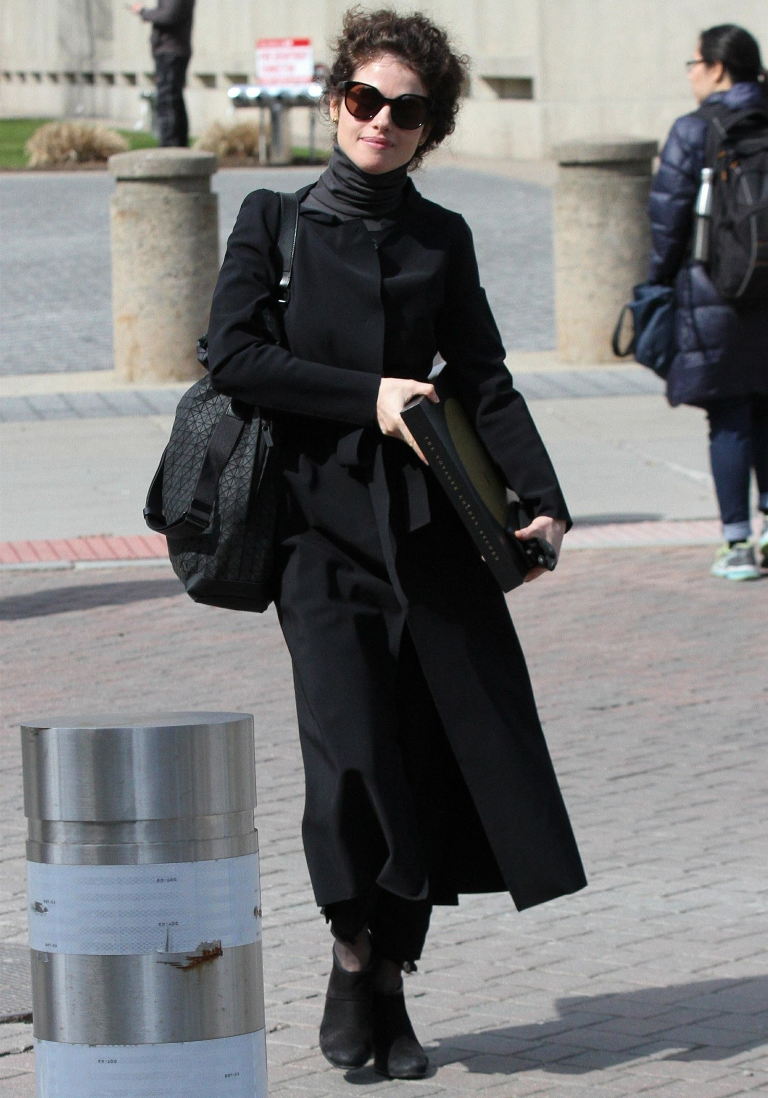Neri Oxman rocks all black and carries "The Voyager Record'' while heading to class at MIT