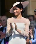 Meghan, Duchess of Sussex, attends a garden party at Buckingham Palace as part of the celebrations of the 70th birthday of the Prince of Wales